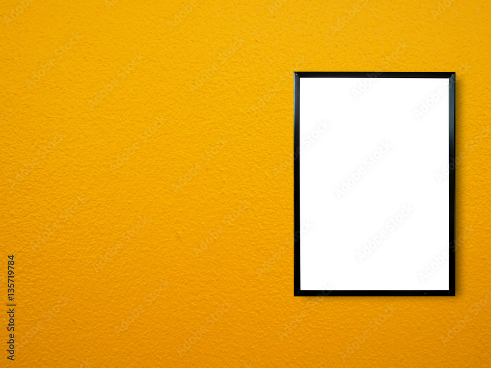 poster frame on yellow paint wall background poster frame on yellow paint wall background