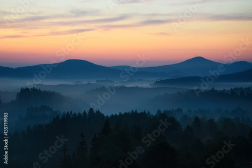Fototapeta Naklejka Na Ścianę i Meble -  Sunrise in Bohemian Switzerland with typical foggy atmosphere, Czech republic