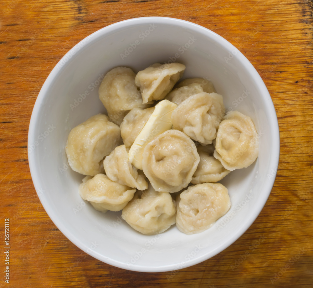 Homemade Meat Dumplings or Russian Pelmeni with Butter Homemade Meat Dumplings or Russian Pelmeni with Butter