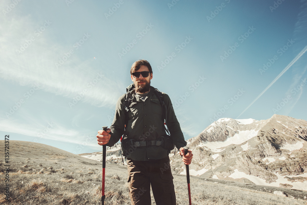 Bearded Man backpacker hiking in mountains Travel Lifestyle concept adventure active summer vacations outdoor mountaineering sport