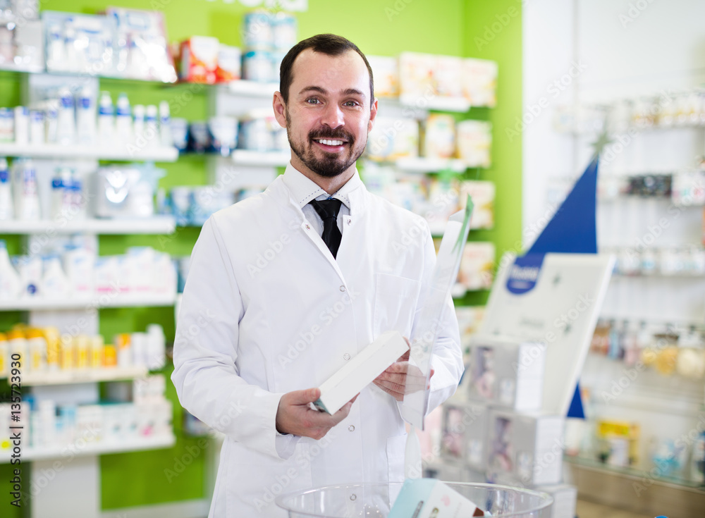 Male pharmacist offering right drug