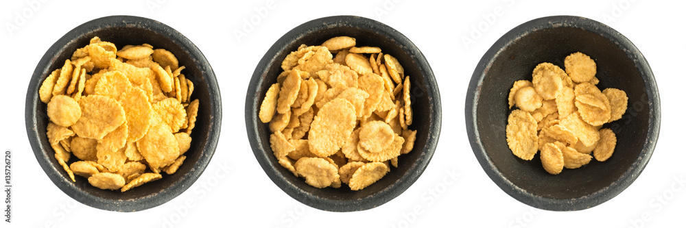 Dry Corn Flakes Heap in Black Iron Bowl Dry Corn Flakes Heap in Black Iron Bowl