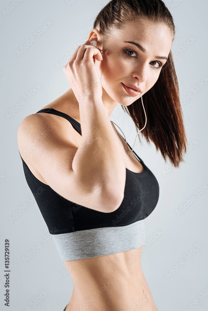 Fototapeta premium Active woman posing with headphones