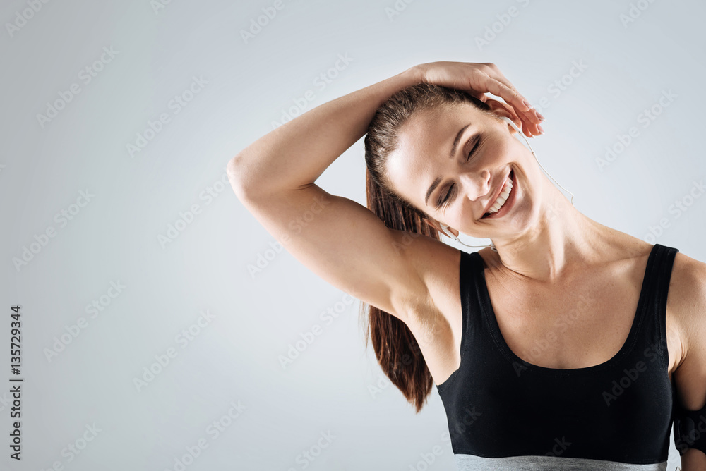 Smiling woman relaxing after training