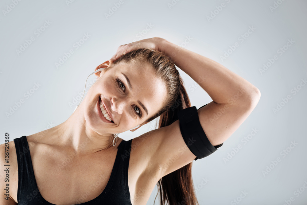 Delighted woman relaxing after training