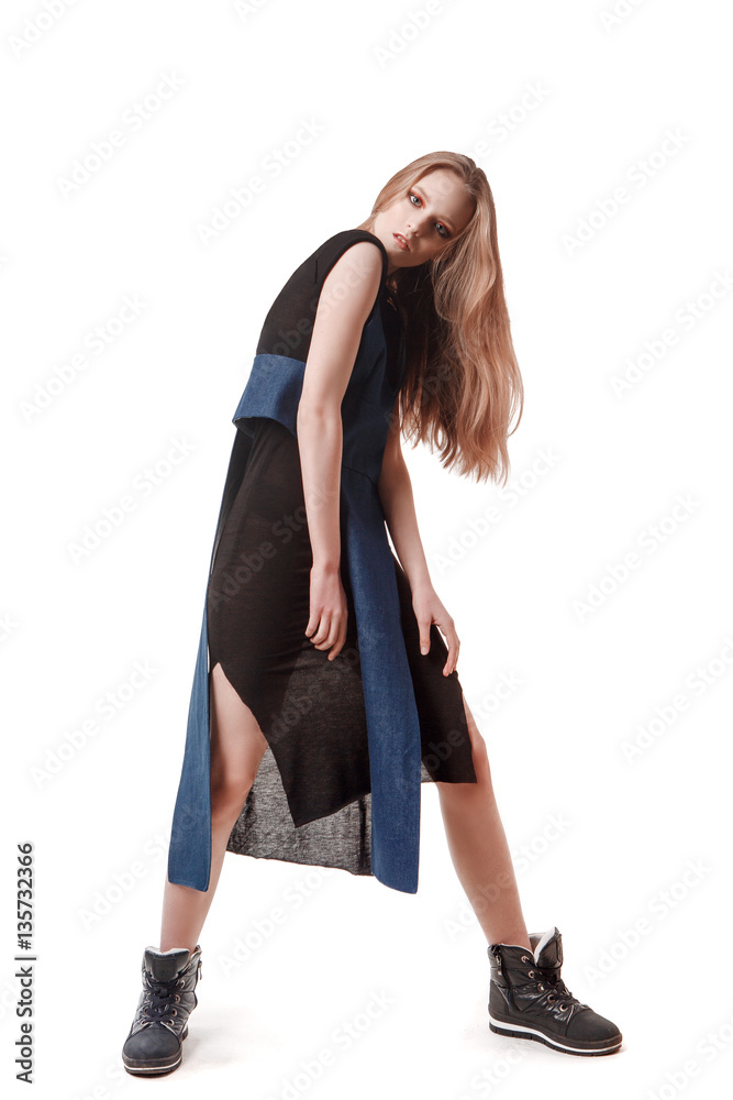 the sexy strict woman with makeup and a fashionable hairstyle poses in studio on a white background the sexy strict woman with makeup and a fashionable hairstyle poses in studio on a white background