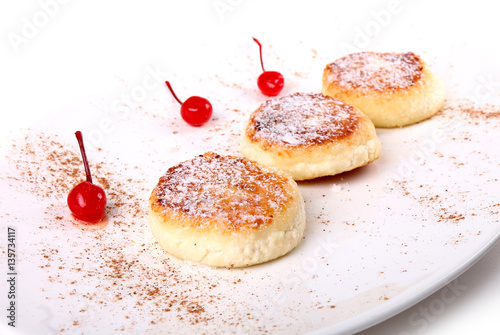 Syrniki laying on a plate photo