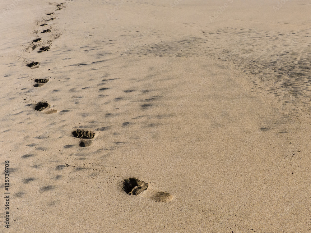 Footprints in the sand – sandy beach. Footprints in the sand – sandy beach.
