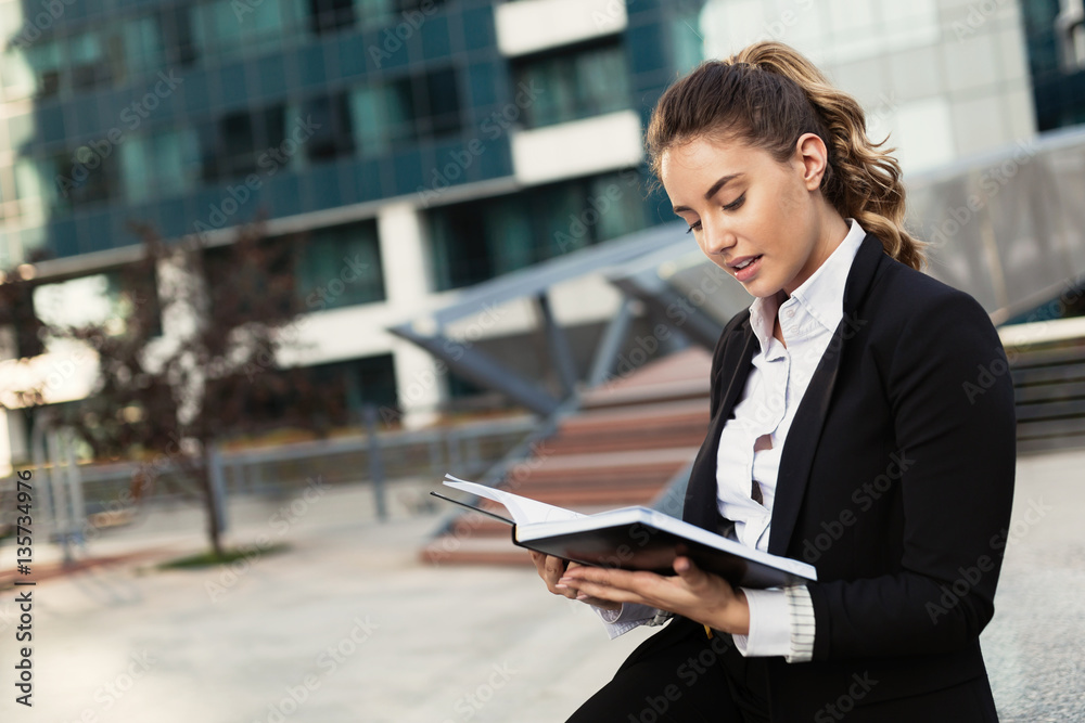 Beautiful businesswoman in business district Beautiful businesswoman in business district