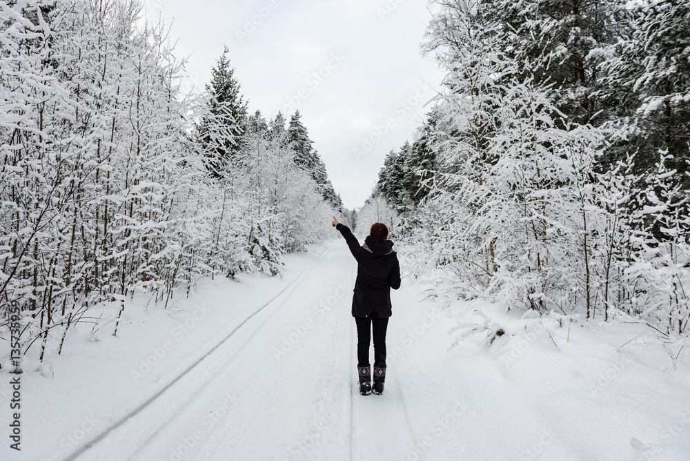 young woman enjoying nature in winter