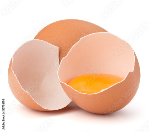 Broken egg in eggshell half and raw egg isolated on white backgr