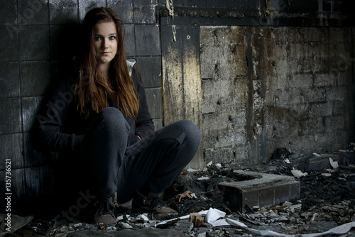 young woman in a burned house © itsajoop