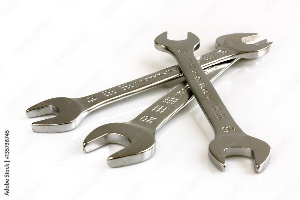 Three open end wrenches isolated on white background. Picture taken in studio with soft-box. Three open end wrenches isolated on white background. Picture taken in studio with soft-box.