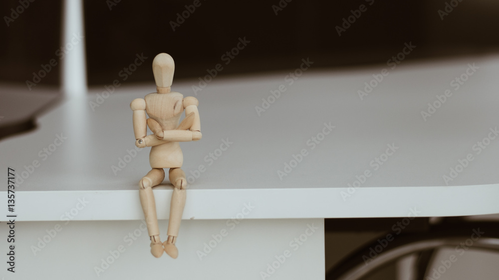 Wooden Man - Lonely figure sitting alone Wooden Man - Lonely figure sitting alone