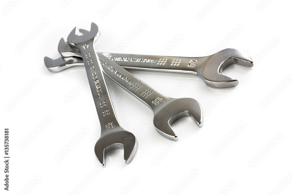 Three open end wrenches isolated on white background. Picture taken in studio with soft-box. Three open end wrenches isolated on white background. Picture taken in studio with soft-box.