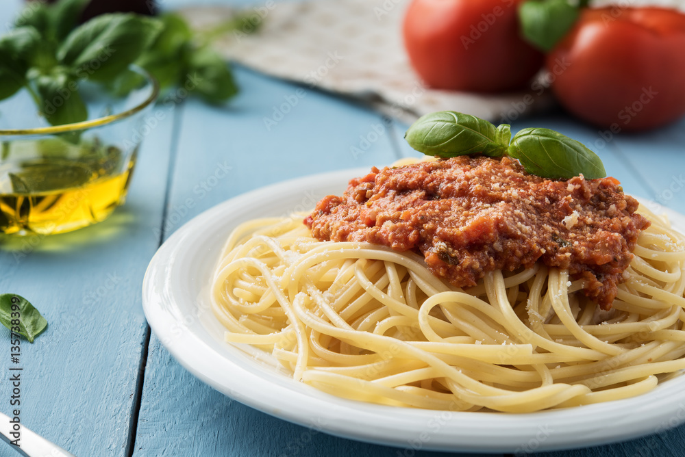 Traditional Italian spaghetti bolognese on wooden background Traditional Italian spaghetti bolognese on wooden background