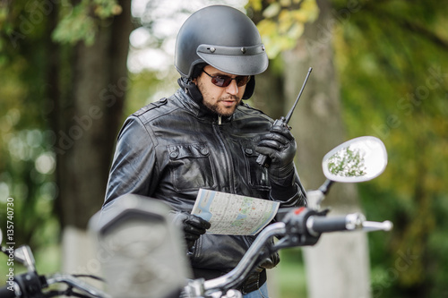man with motorcycle. people, travel lifestyle concept