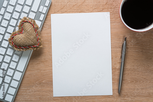 Blank notepad on wooden table photo