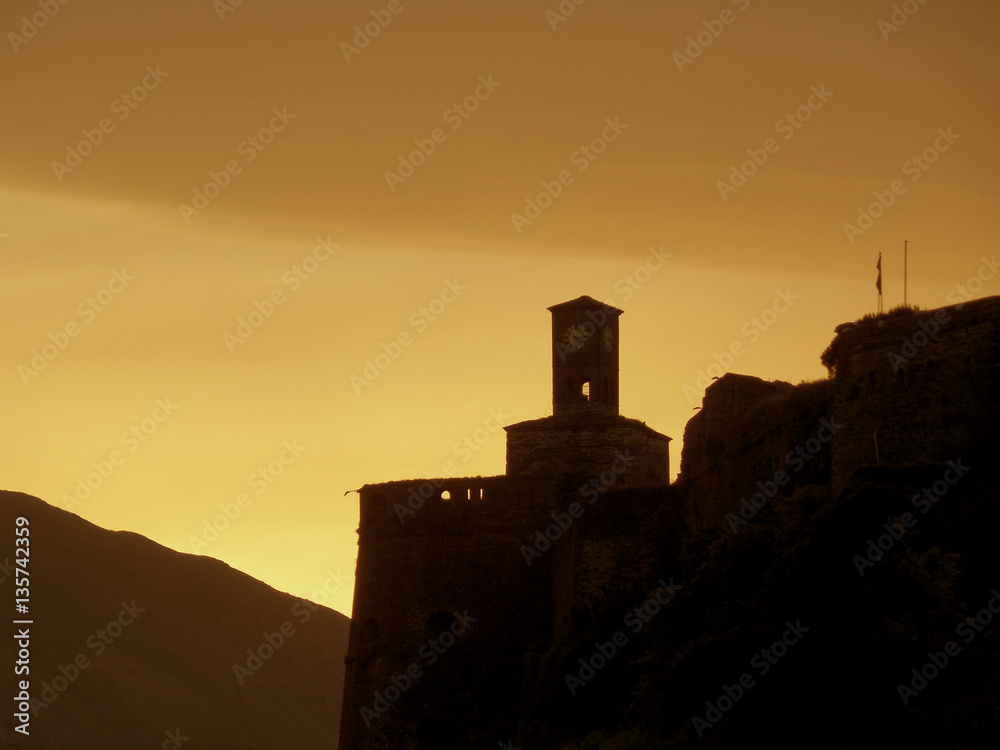 Obraz premium Before sunrise! Silhouette of Gjirokaster Castle against the Early Morning Sky, Gjirokaster, Albania 