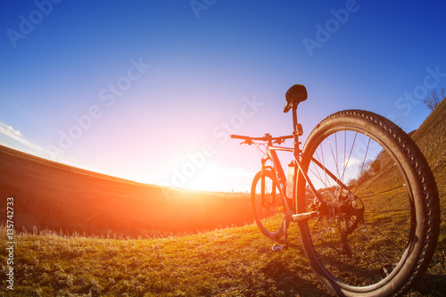 One cycle on a bright day with beautiful landscape background