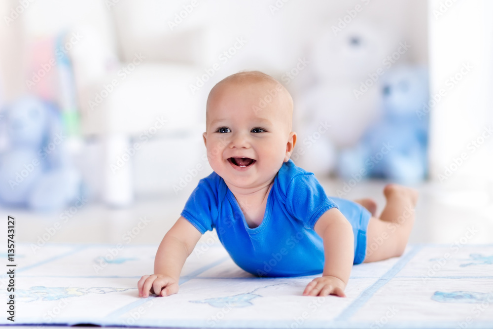 Baby boy playing and learning to crawl Baby boy playing and learning to crawl