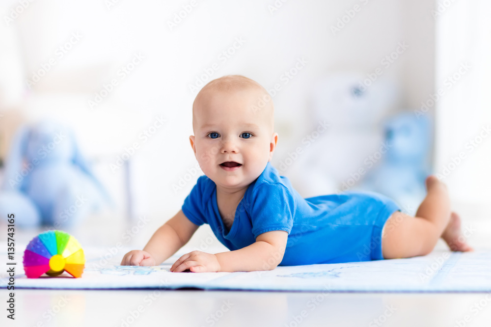 Baby boy playing with toy ball Baby boy playing with toy ball