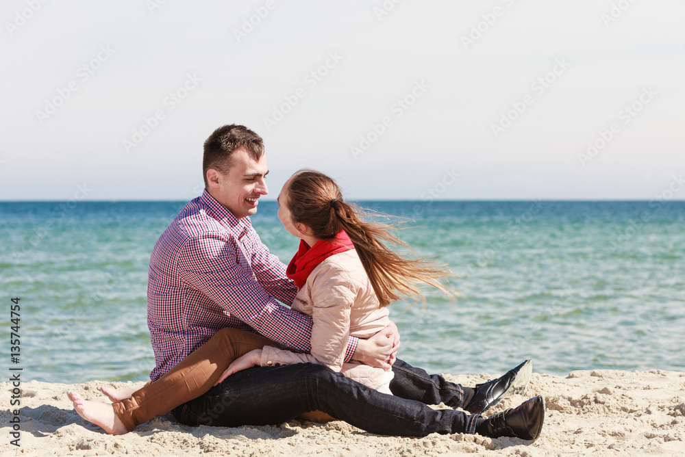Happy couple having date on beach Happy couple having date on beach