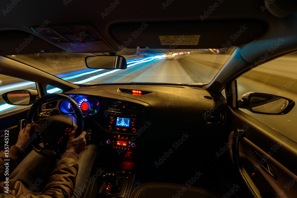 the driver drives a car into the traffic