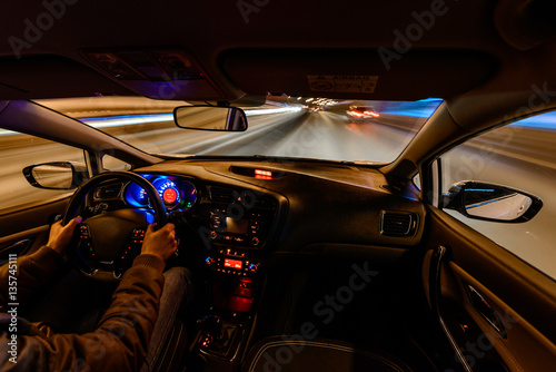 Fototapeta Naklejka Na Ścianę i Meble -  the driver drives a car into the traffic