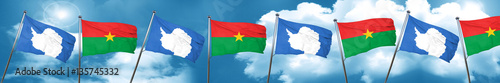 antarctica flag with Burkina Faso flag, 3D rendering