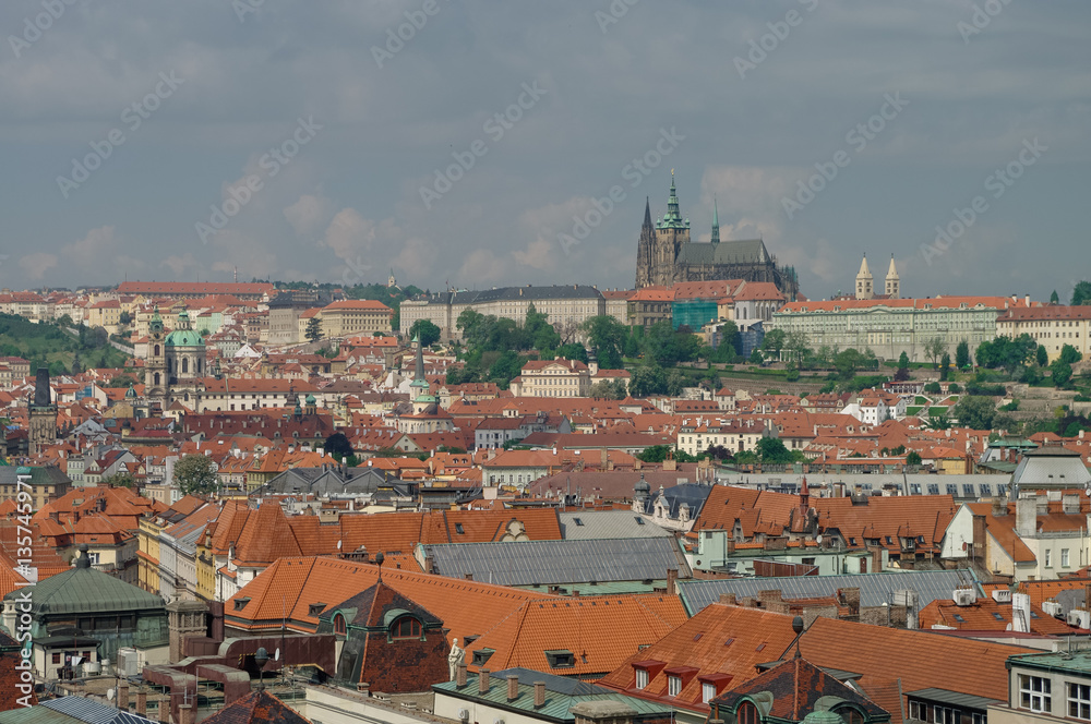 Fototapeta premium View from above to tiled roofs of old town, panorama of Prague, Czech republic