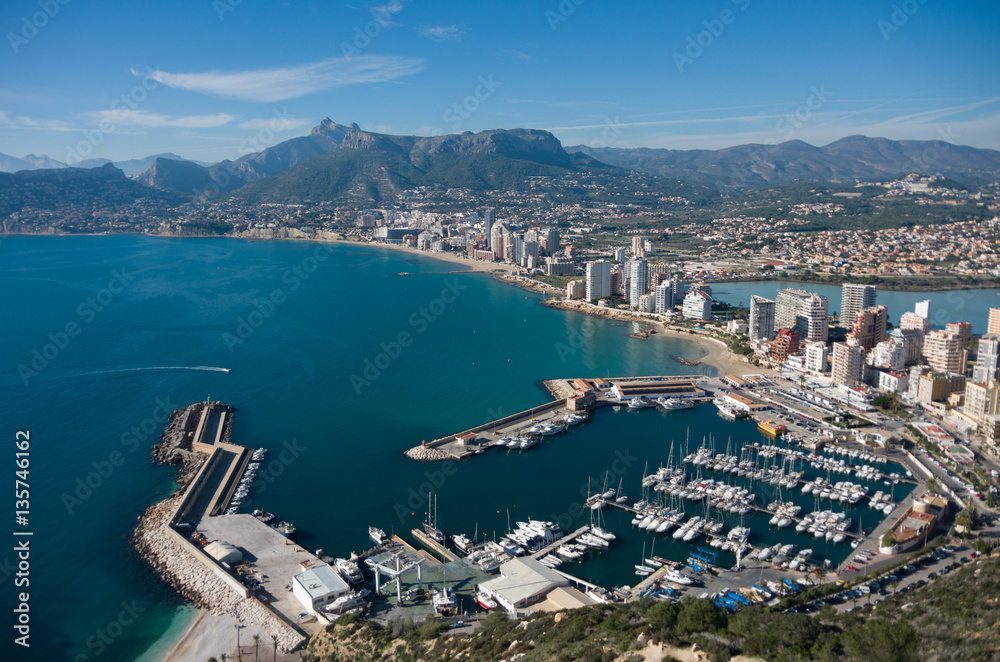 View over Calpe (Calp) town, Spain. Shot from the Penon  ( Ifach) rock, overlooking the coast, the harbor, lake and the city