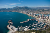 View over Calpe (Calp) town, Spain. Shot from the Penon  ( Ifach) rock, overlooking the coast, the harbor, lake and the city