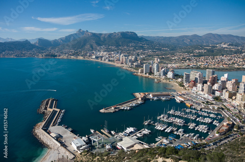 View over Calpe (Calp) town, Spain. Shot from the Penon ( Ifach) rock, overlooking the coast, the harbor, lake and the city