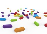 3d illustration of colored pills. white background isolated. icon for game web.