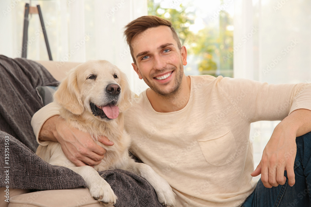 Cool dog and young man having fun at home Cool dog and young man having fun at home