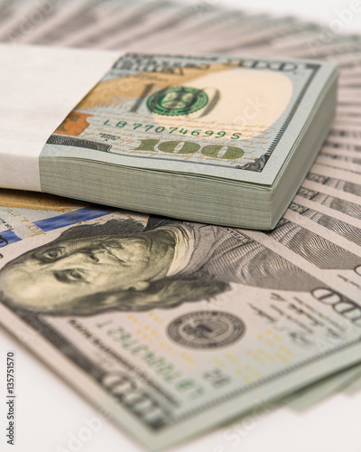 Stack of money in US dollars cash banknotes