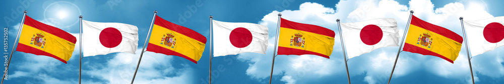 Spanish flag with Japan flag, 3D rendering Spanish flag with Japan flag, 3D rendering