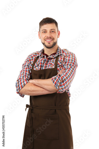 Handsome man in apron isola...