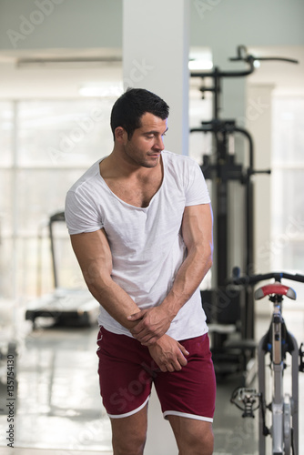 Strong Man in White T-shirt Background Gym
