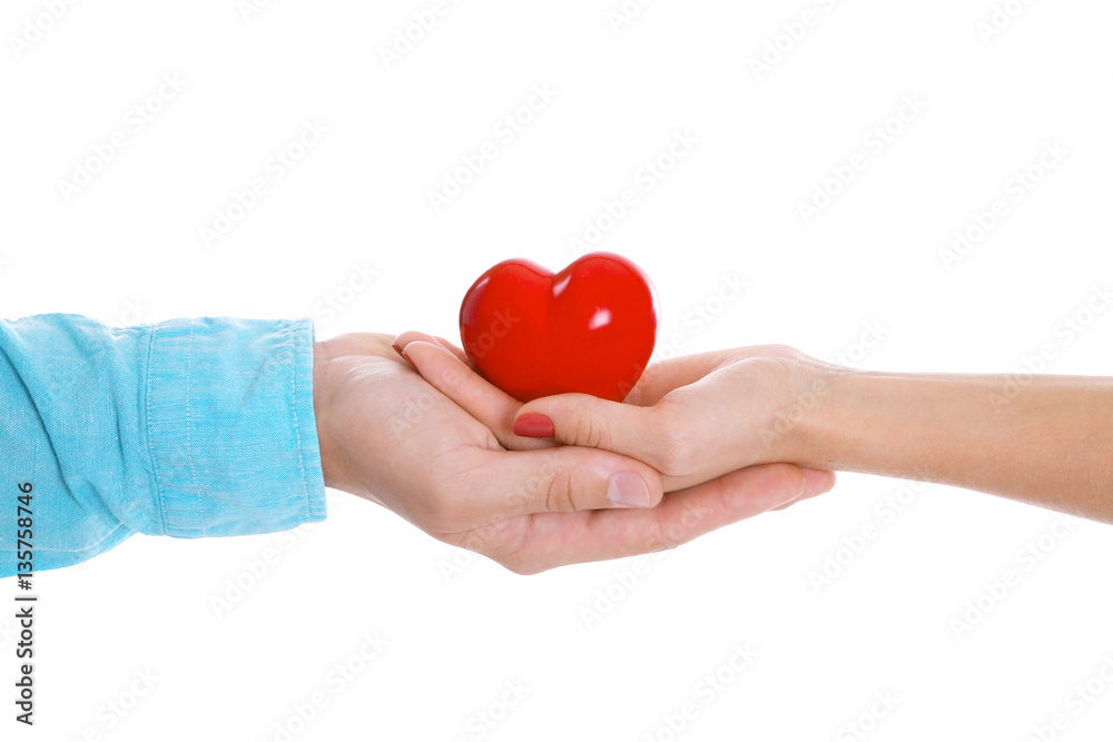 Fototapeta premium Couple hands with red heart on white background