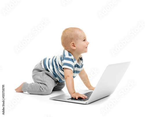 Cute baby boy with laptop o...