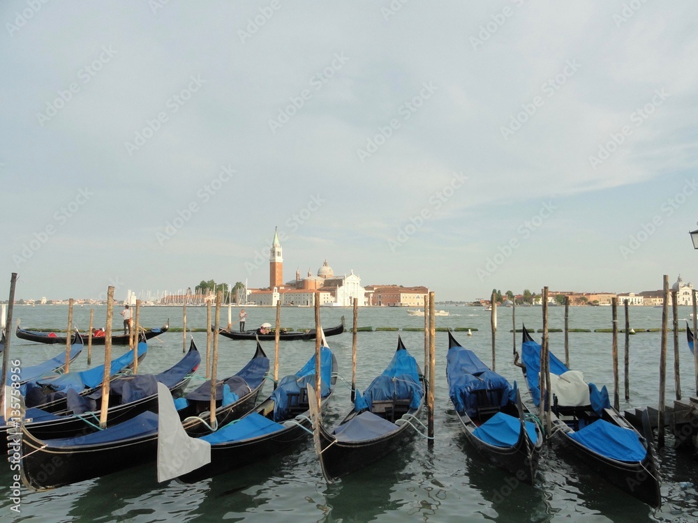 Row of Blue Gondolas in Venice