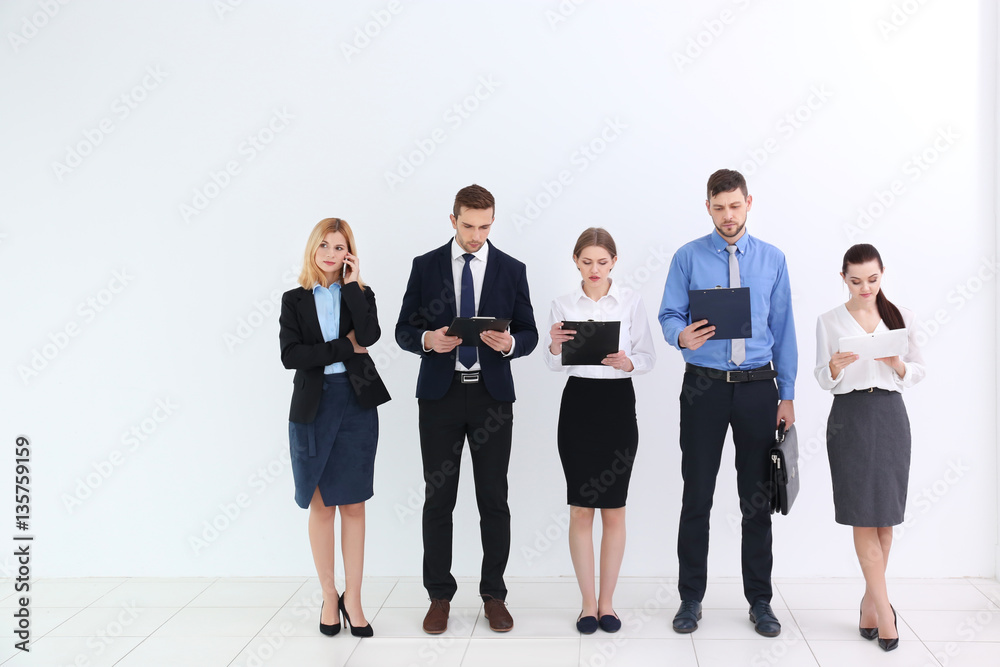 Group of people waiting for job interview and standing on white background Group of people waiting for job interview and standing on white background