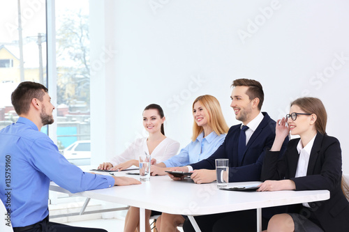 Job interview concept. Human resources commission interviewing man