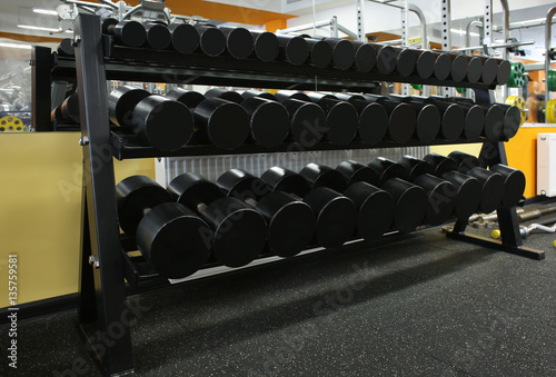 Dumbbells on stand in a gym