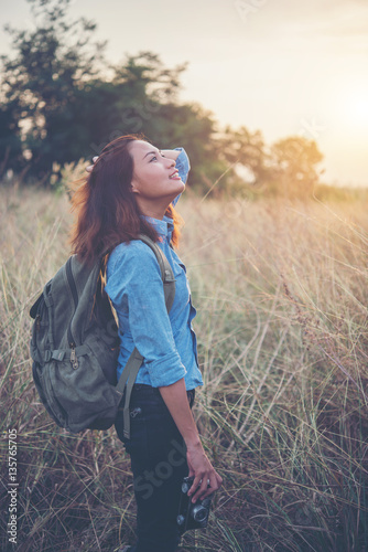 Vintage tone images of beautiful young hipster woman with backpack. © Johnstocker