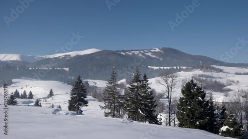 Wallpaper Mural Pan View of Mountain Ridge and Snow Covered Mountains, Traditional Village and Rural Landscape in Winter Sunny Day Panning Torontodigital.ca