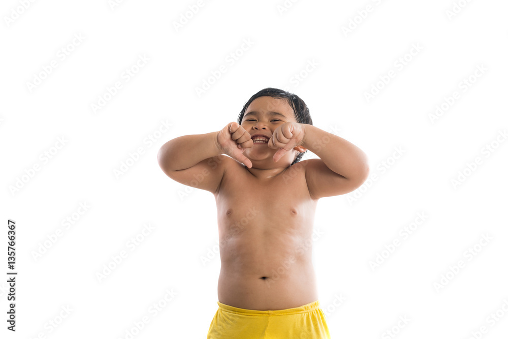 Fototapeta premium Cute little boy standing and looking at camera, enjoy playing.