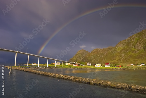 Summer landscape with a bridge and rainbow in one of fjords of Norway 